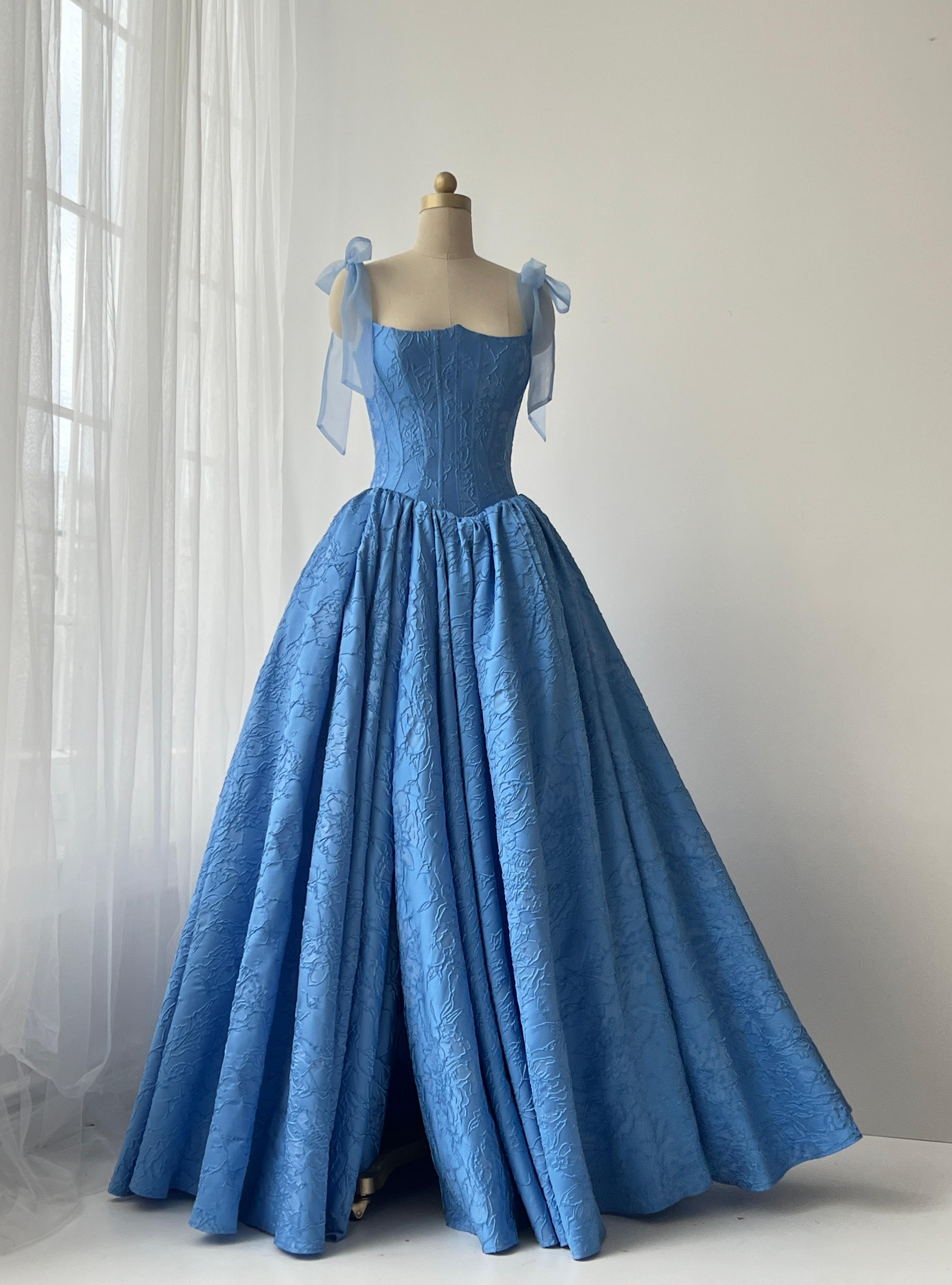 Blue A-Line gown with bow straps and brocade fabric