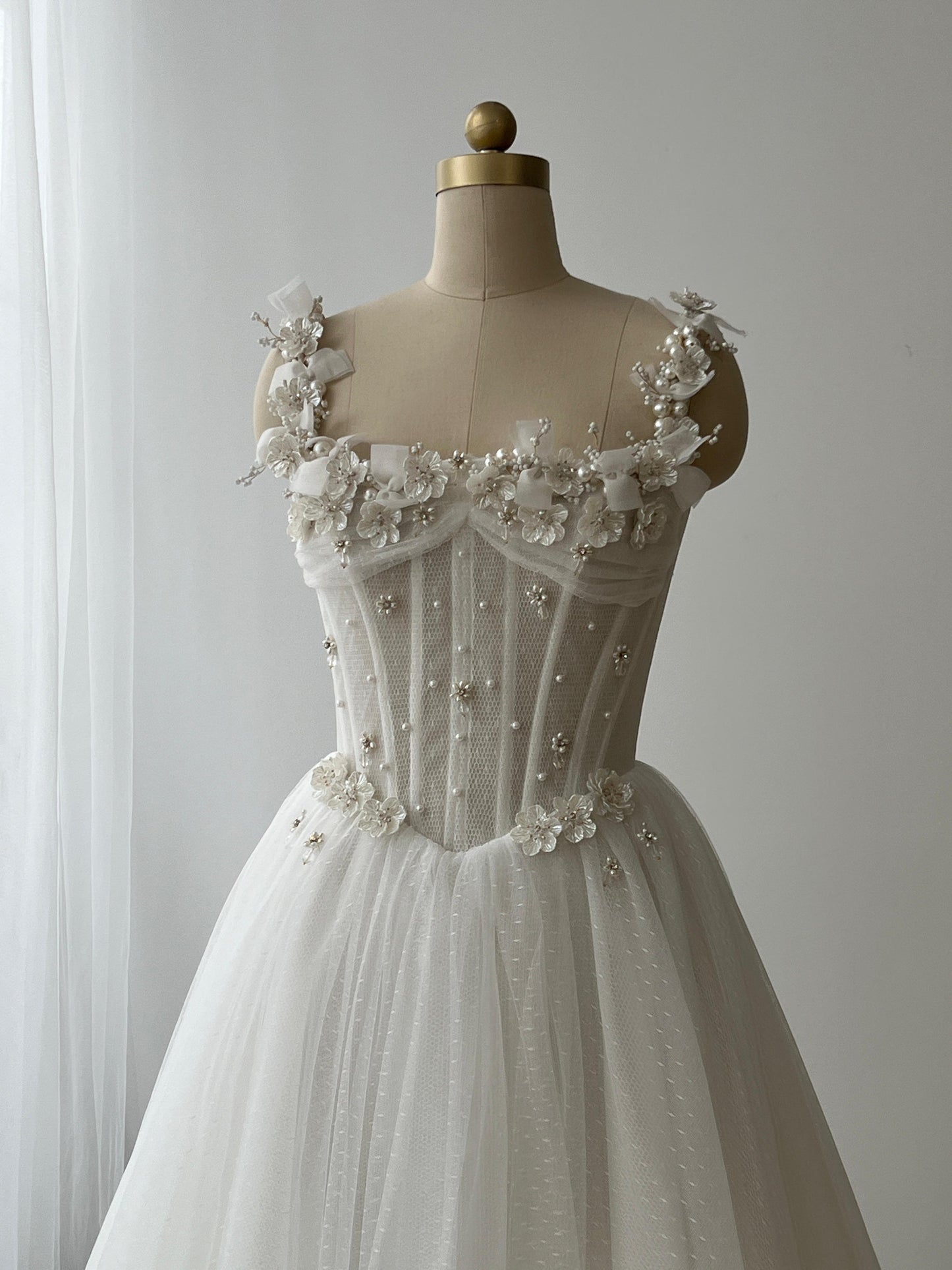 White bridal A-Line gown with straps, embroidery and pearls