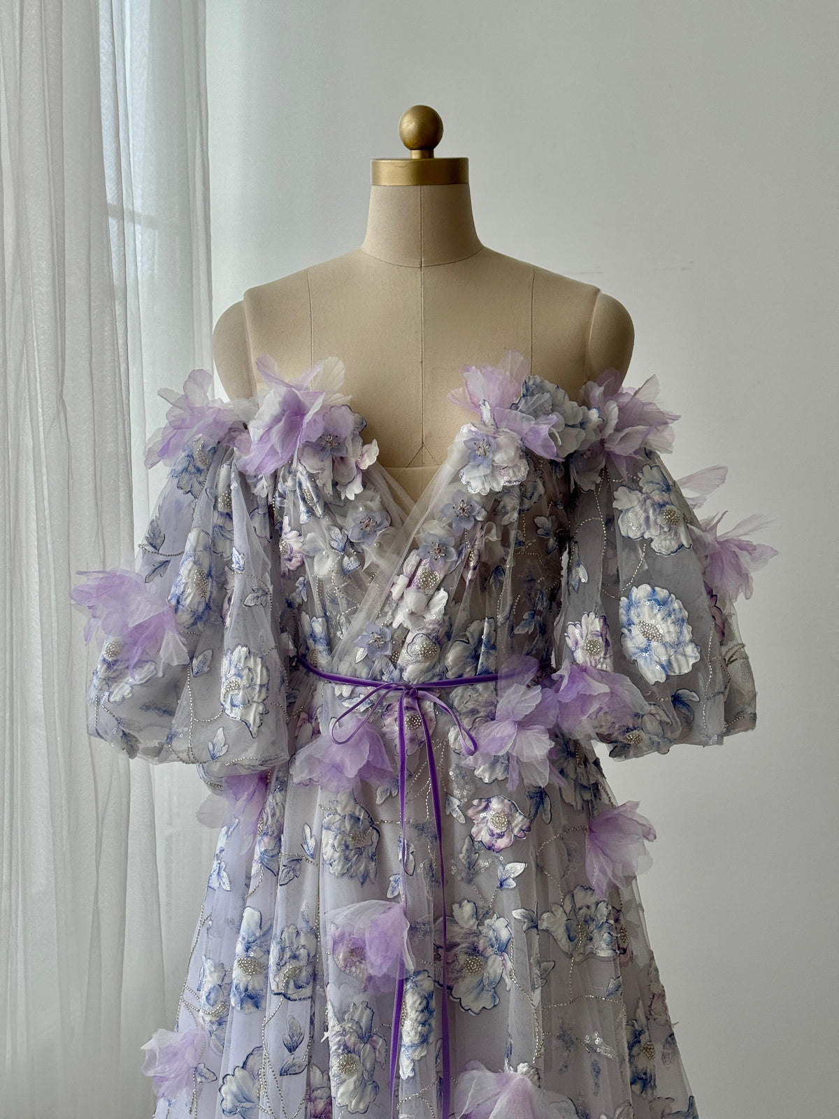 Purple A-Line gown with short off the shoulder sleeves, embroidery and v-neck