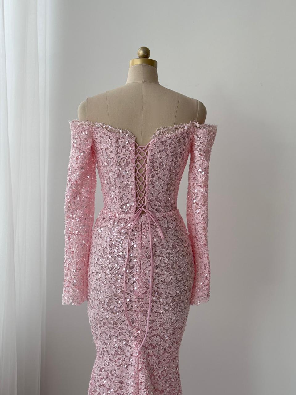 Pink mermaid gown with long off the shoulder sleeves, embroidered bows and lace