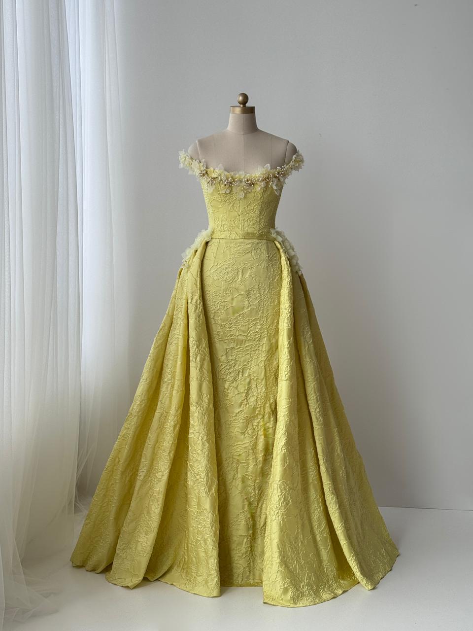 Yellow A-Line gown with overskirt, off the shoulder sleeves and embroidery