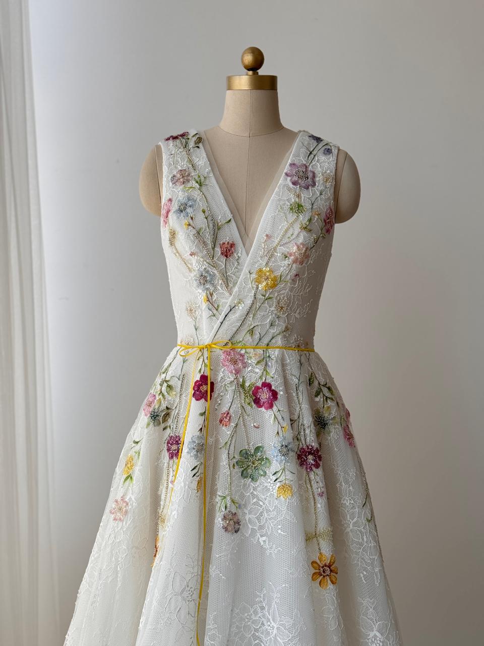 White bridal A-Line gown with floral embroidery, v-neck and no sleeves