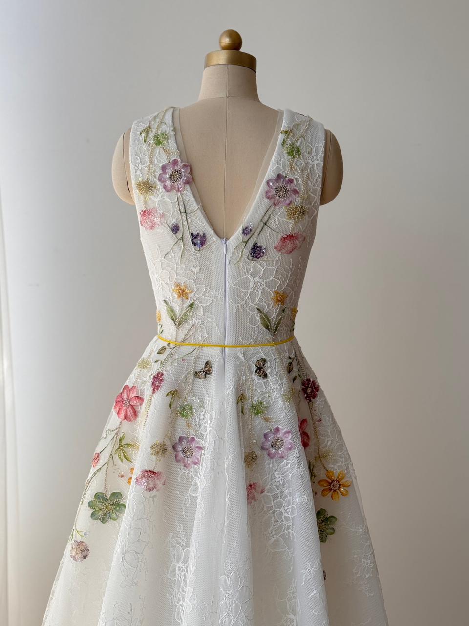 White bridal A-Line gown with floral embroidery, v-neck and no sleeves