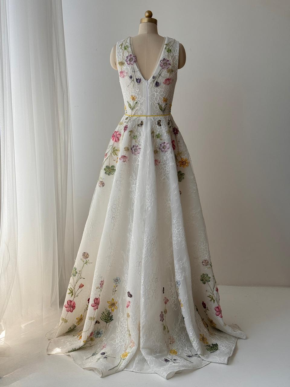 White bridal A-Line gown with floral embroidery, v-neck and no sleeves