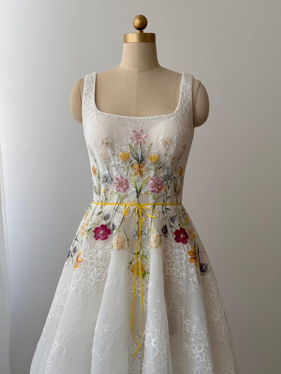 White bridal midi dress with straps and floral embroidery