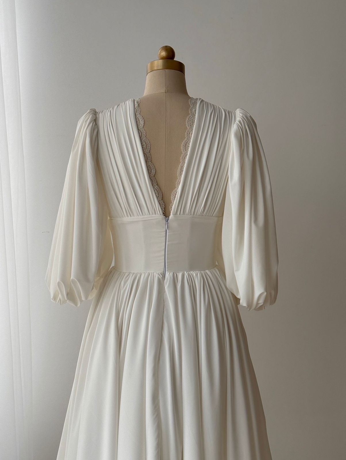 White bridal midi dress with short sleeves, v-neck and embroidered lace