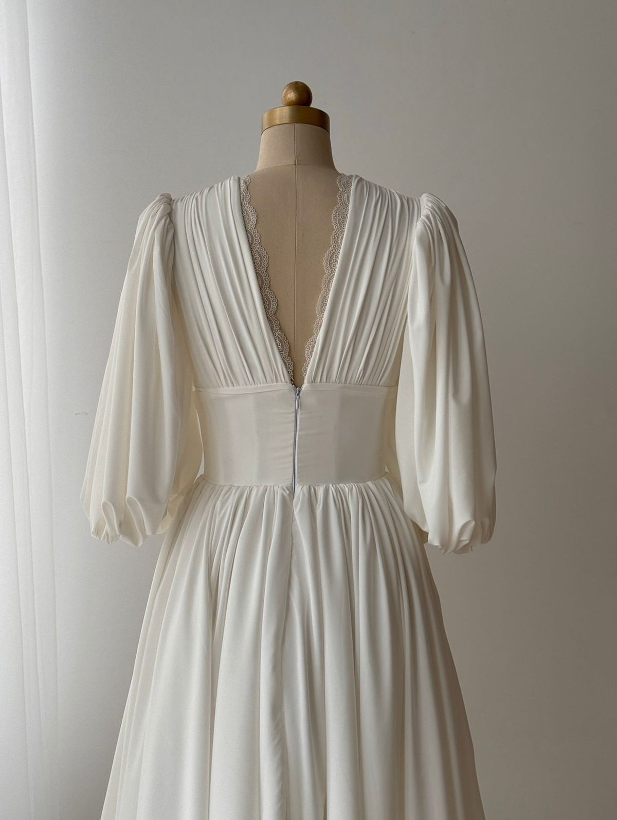 White bridal midi dress with short sleeves, v-neck and embroidered lace