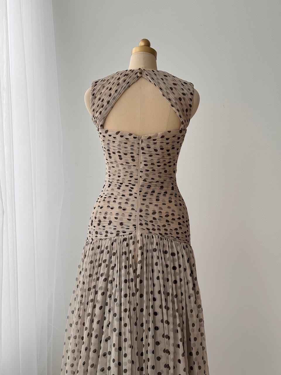 Beige gown with straps, polka dotted tulle fabric and embroidered front bow