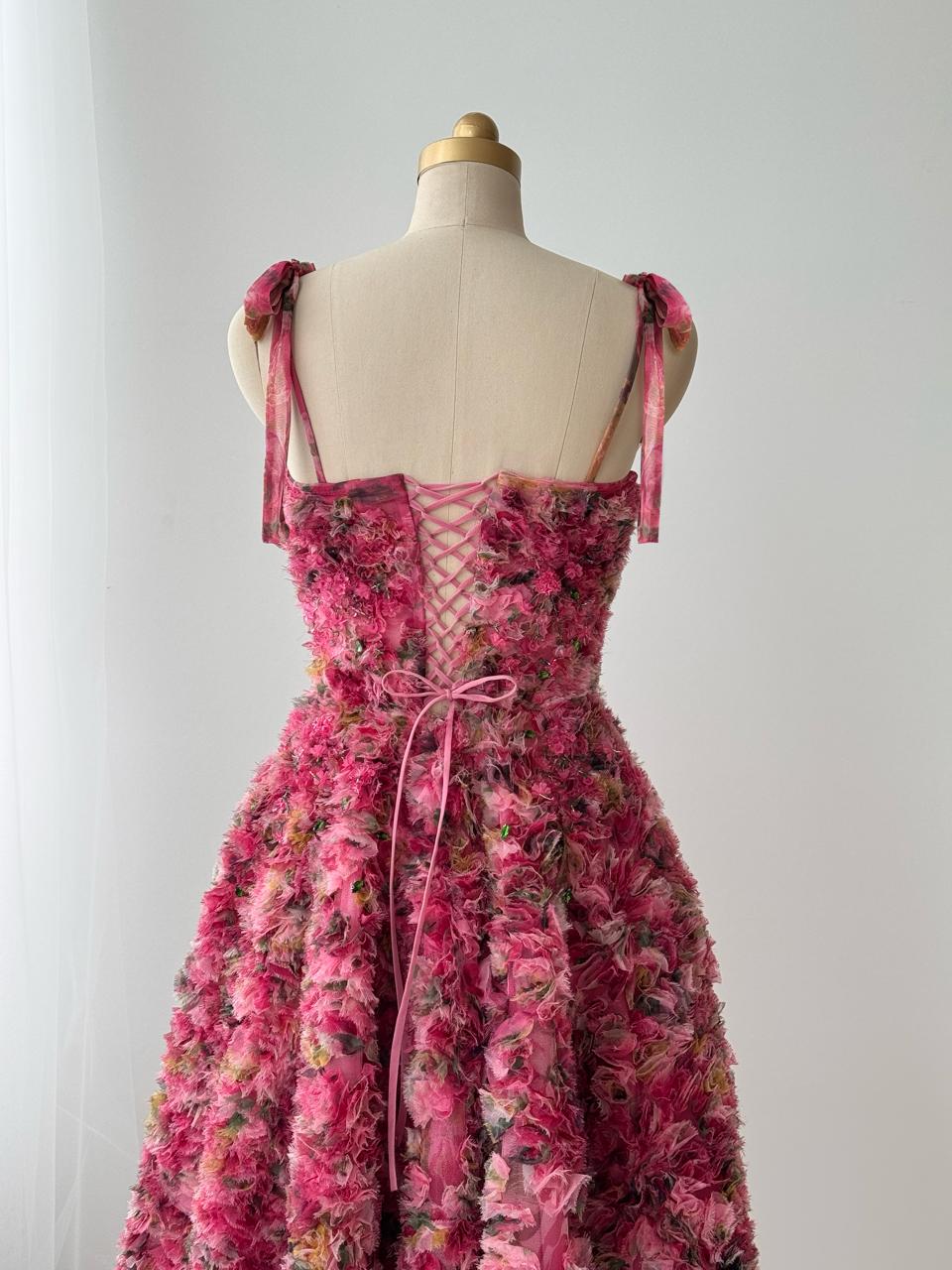 Pink midi dress with floral details, embroidery and bow straps