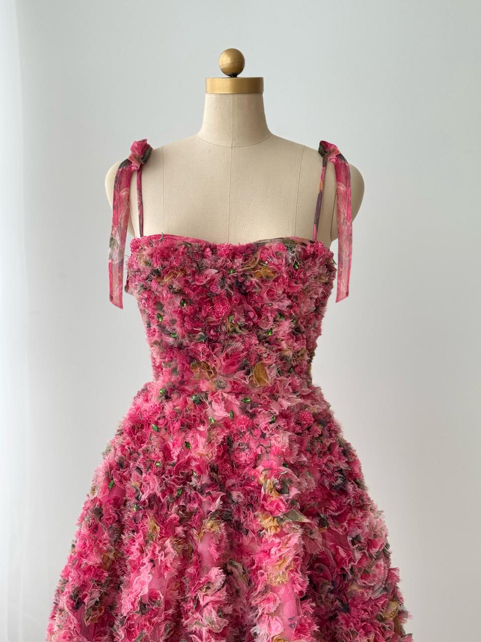 Pink midi dress with floral details, embroidery and bow straps