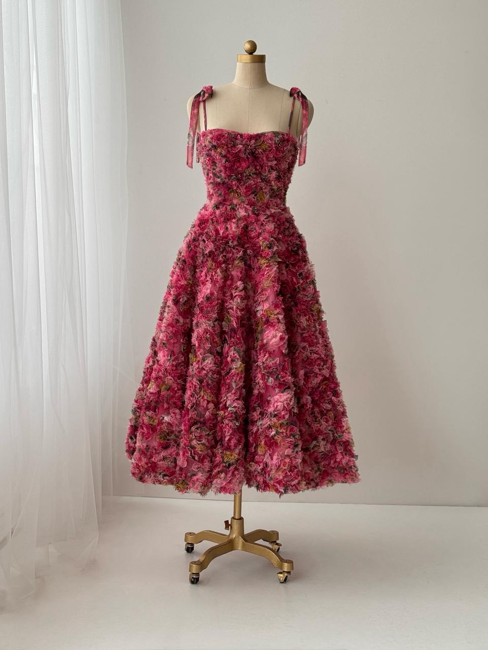 Pink midi dress with floral details, embroidery and bow straps