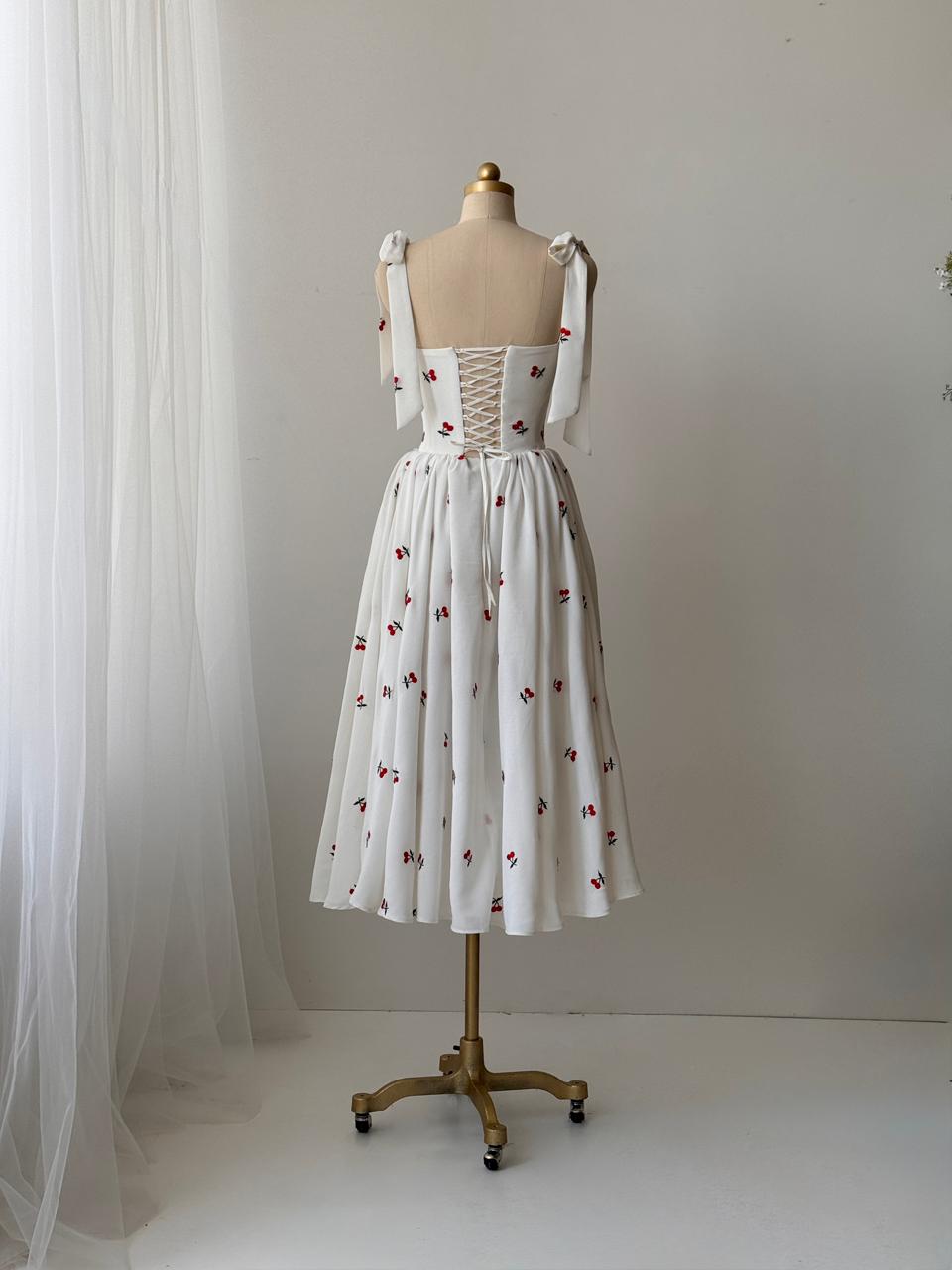 White midi dress with bow straps and cherries