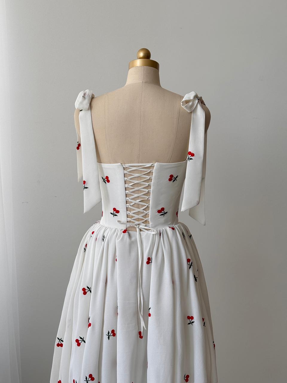 White midi dress with bow straps and cherries