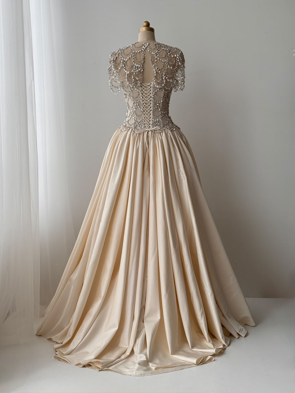 Beige A-Line bridal gown, with short sleeves, beading work and embroidery