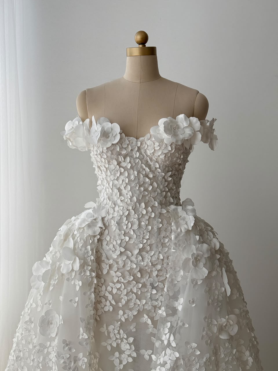 White A-Line bridal gown with off the shoulder sleeves, embroidery and detachable skirt