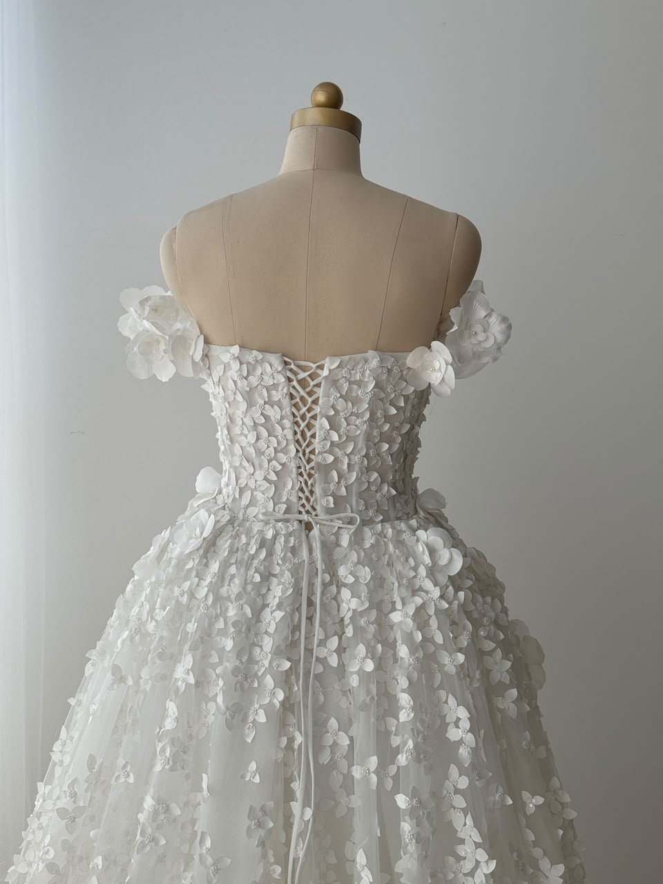 White A-Line bridal gown with off the shoulder sleeves, embroidery and detachable skirt