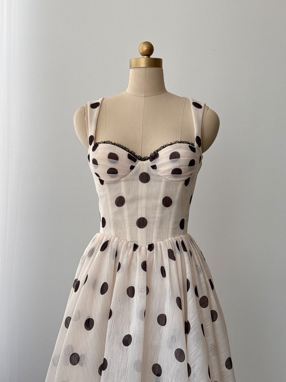 Beige midi dress with polka dotted fabric and straps