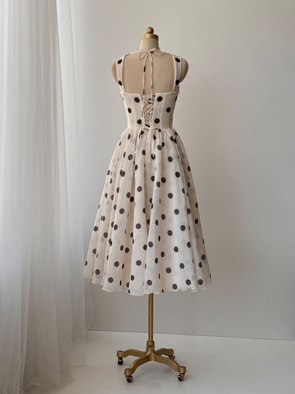 Beige midi dress with polka dotted fabric and straps
