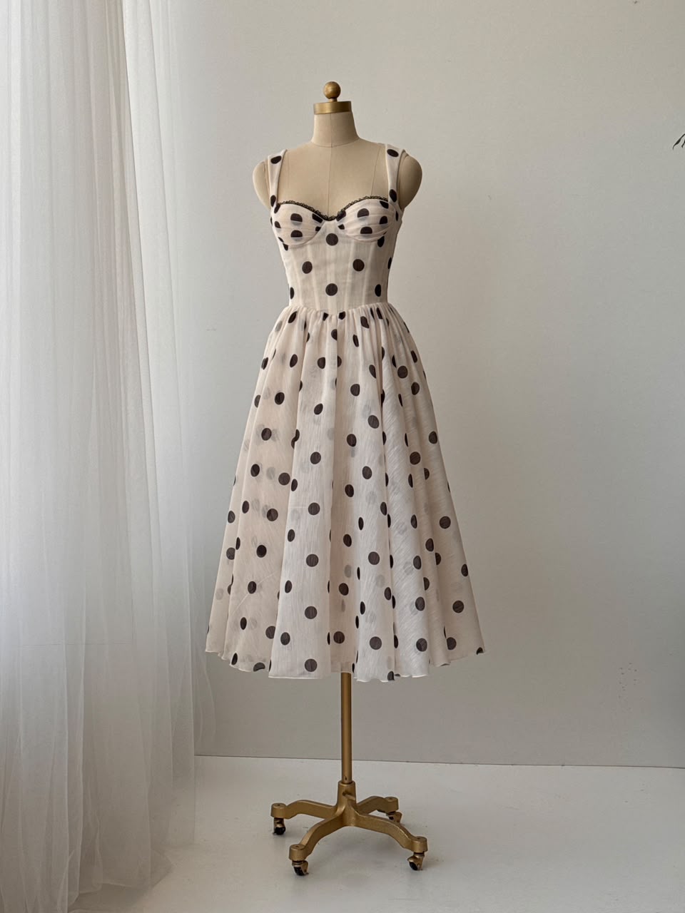 Beige midi dress with polka dotted fabric and straps