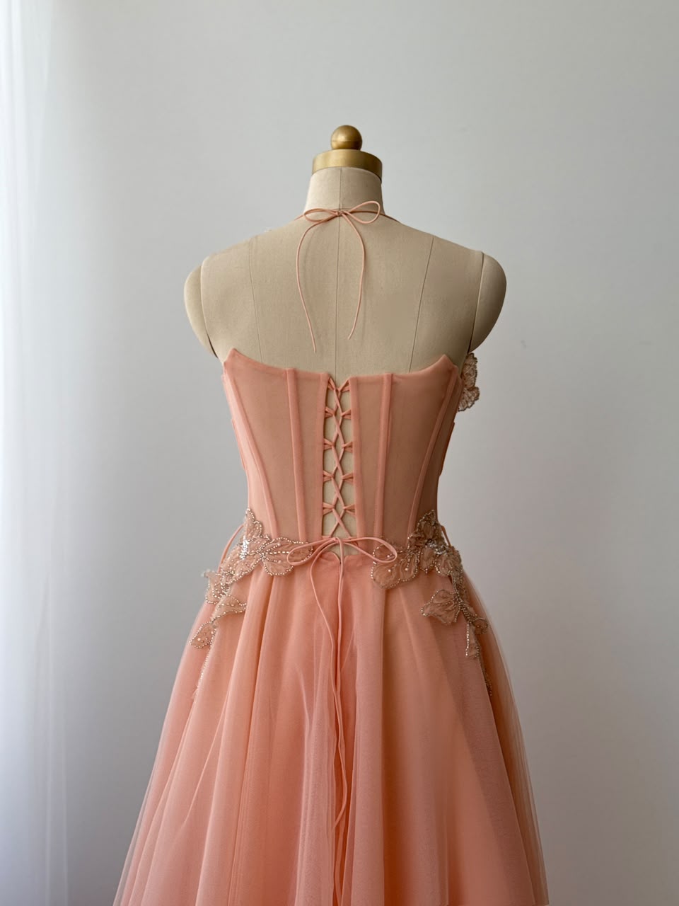 Peach A-Line gown with straps and embroidery
