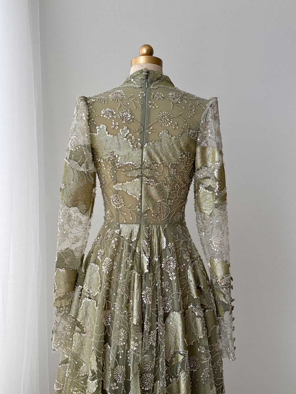 Green A-Line gown with long sleeves, sequins and v-neck
