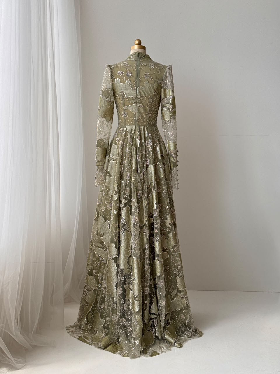 Green A-Line gown with long sleeves, sequins and v-neck