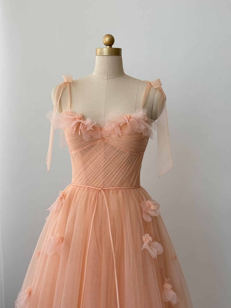 Peach midi dress with bow straps and embroidered flowers