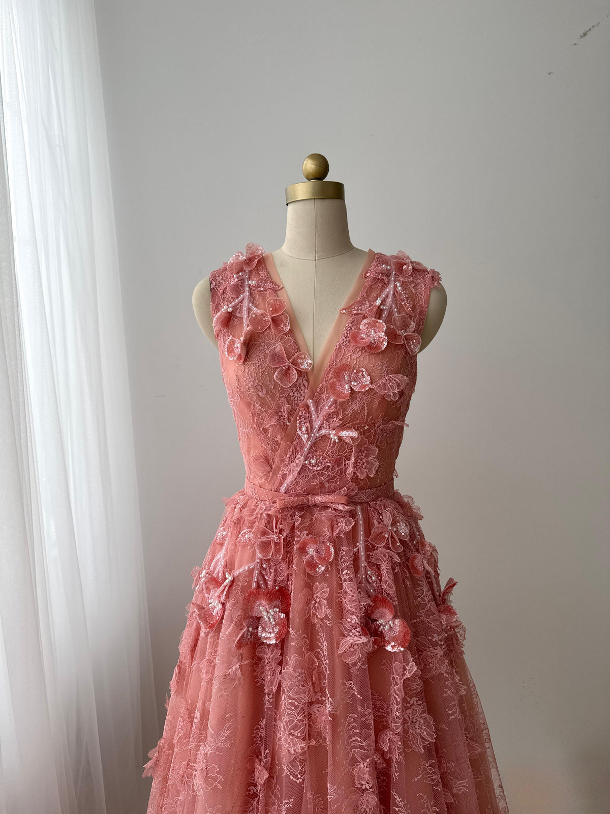 Pink A-Line gown with v-neck, embroidery and no sleeves