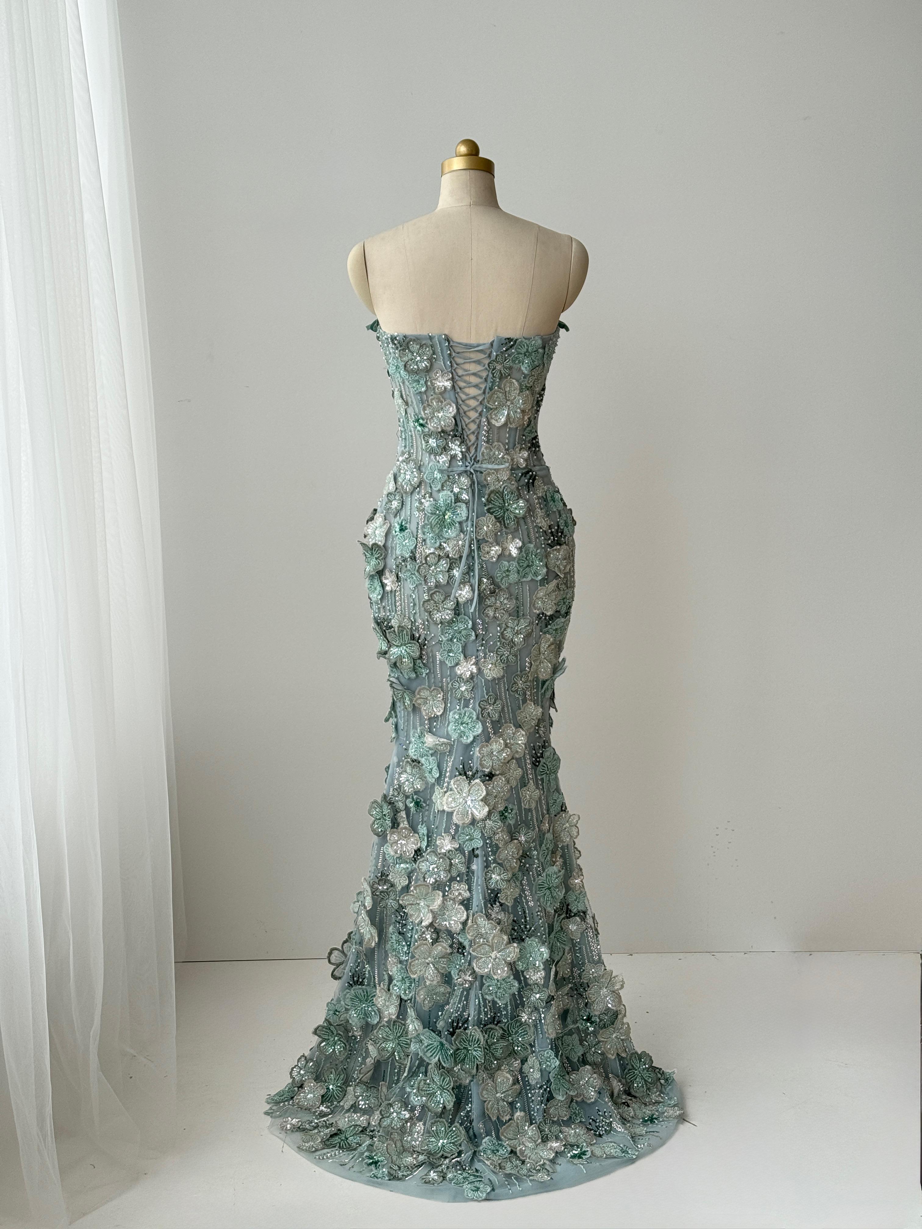 Turquoise mermaid gown with embroidered flowers and no sleeves