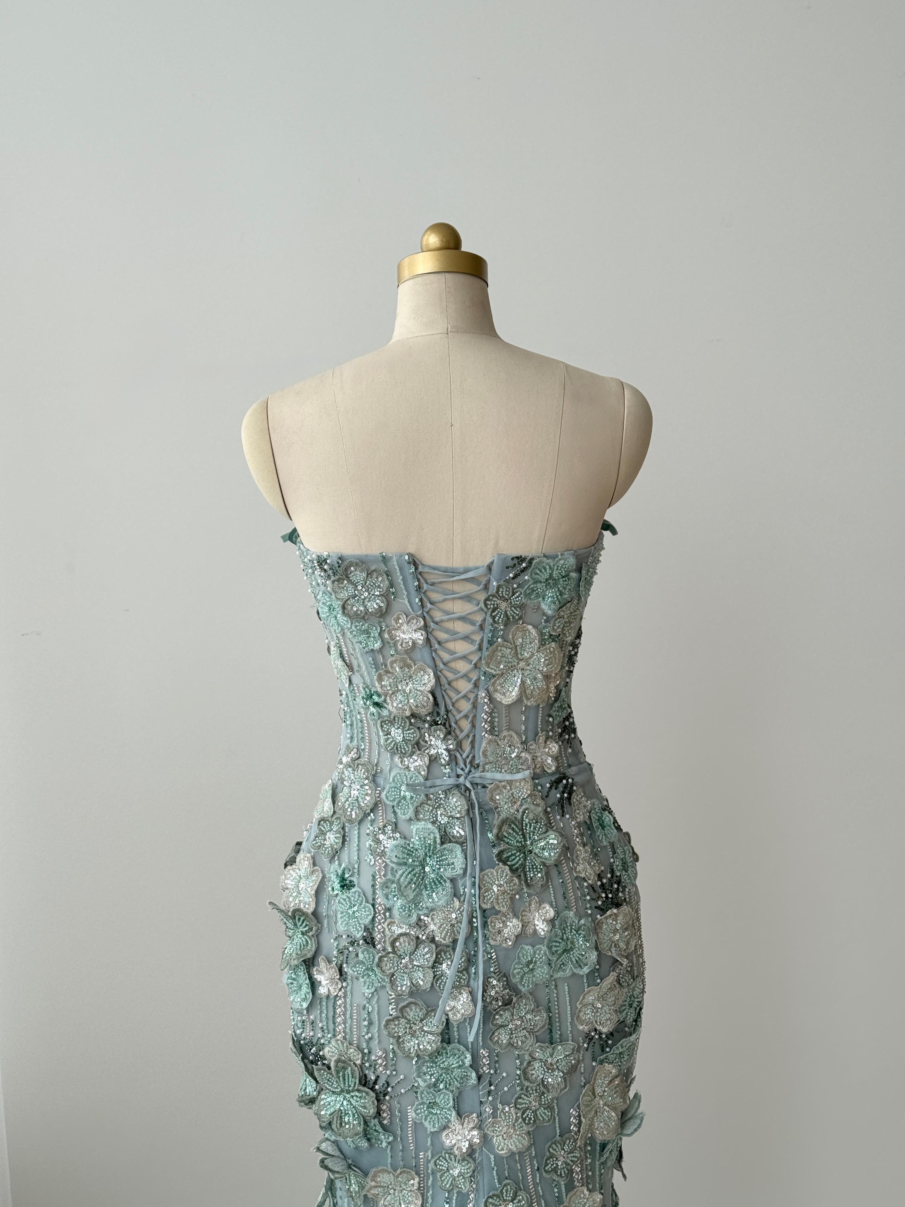 Turquoise mermaid gown with embroidered flowers and no sleeves