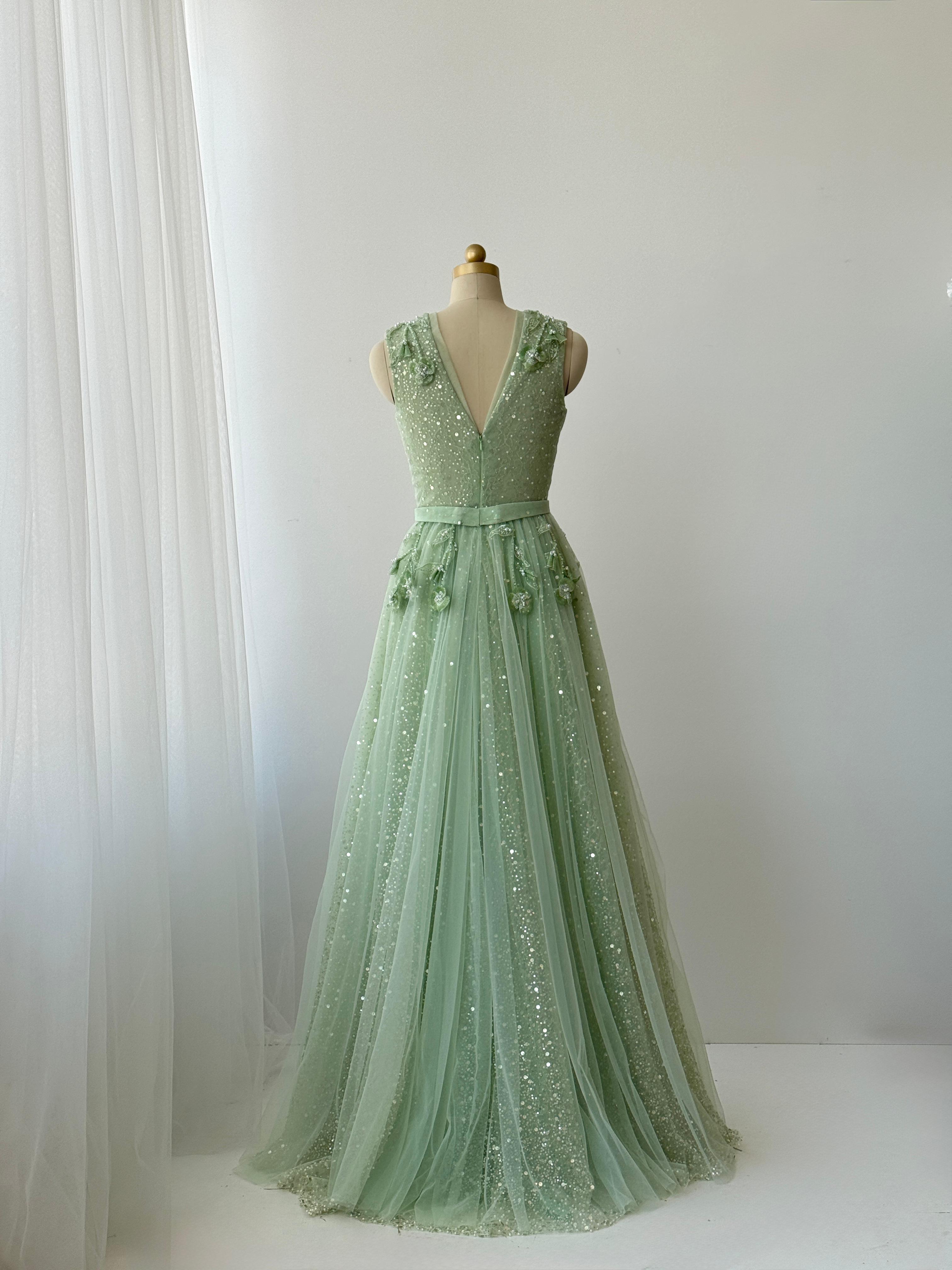 Green A-Line gown with v-neck, embroidery and no sleeves