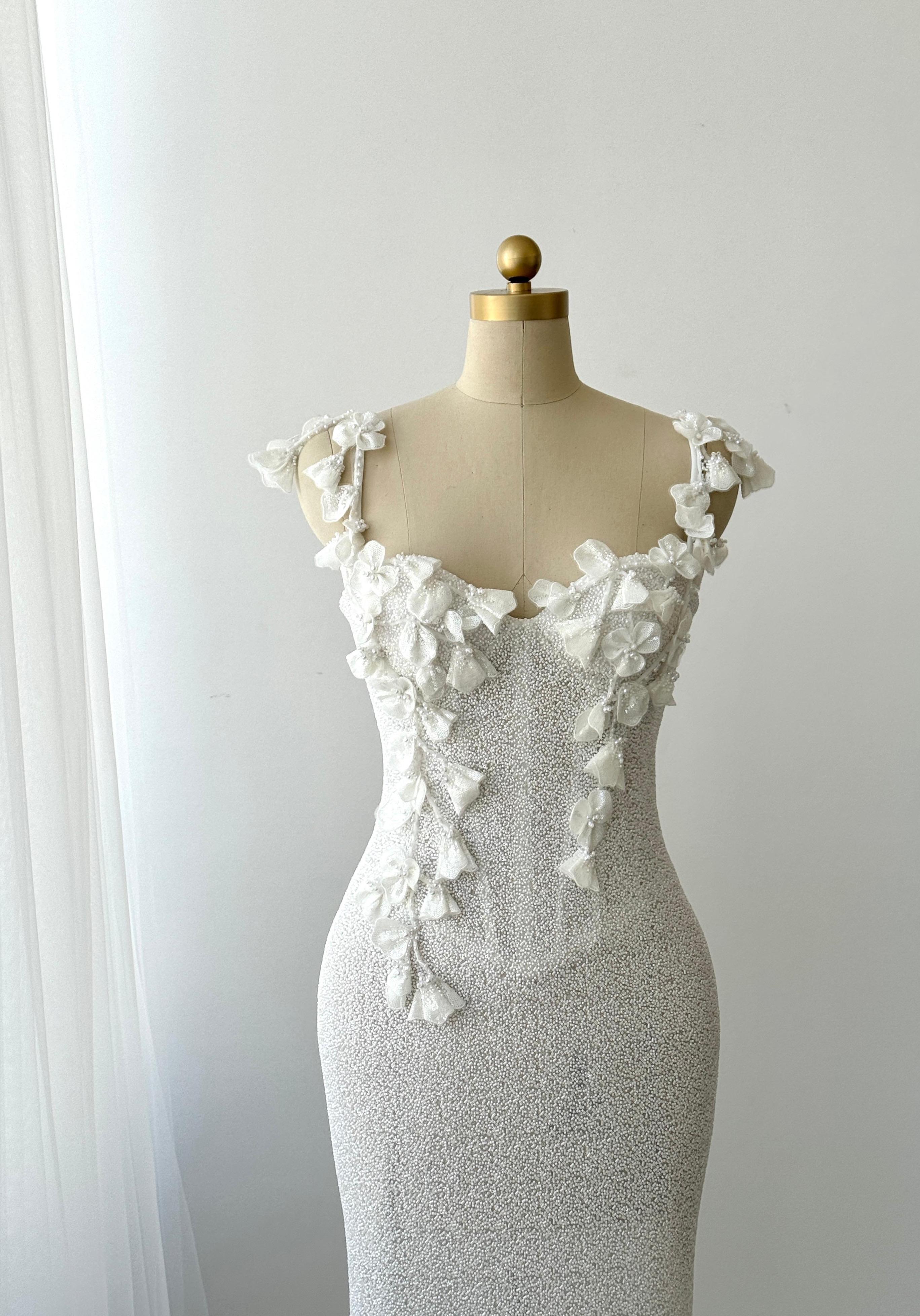 White Mermaid bridal gown with spaghetti straps and embroidery