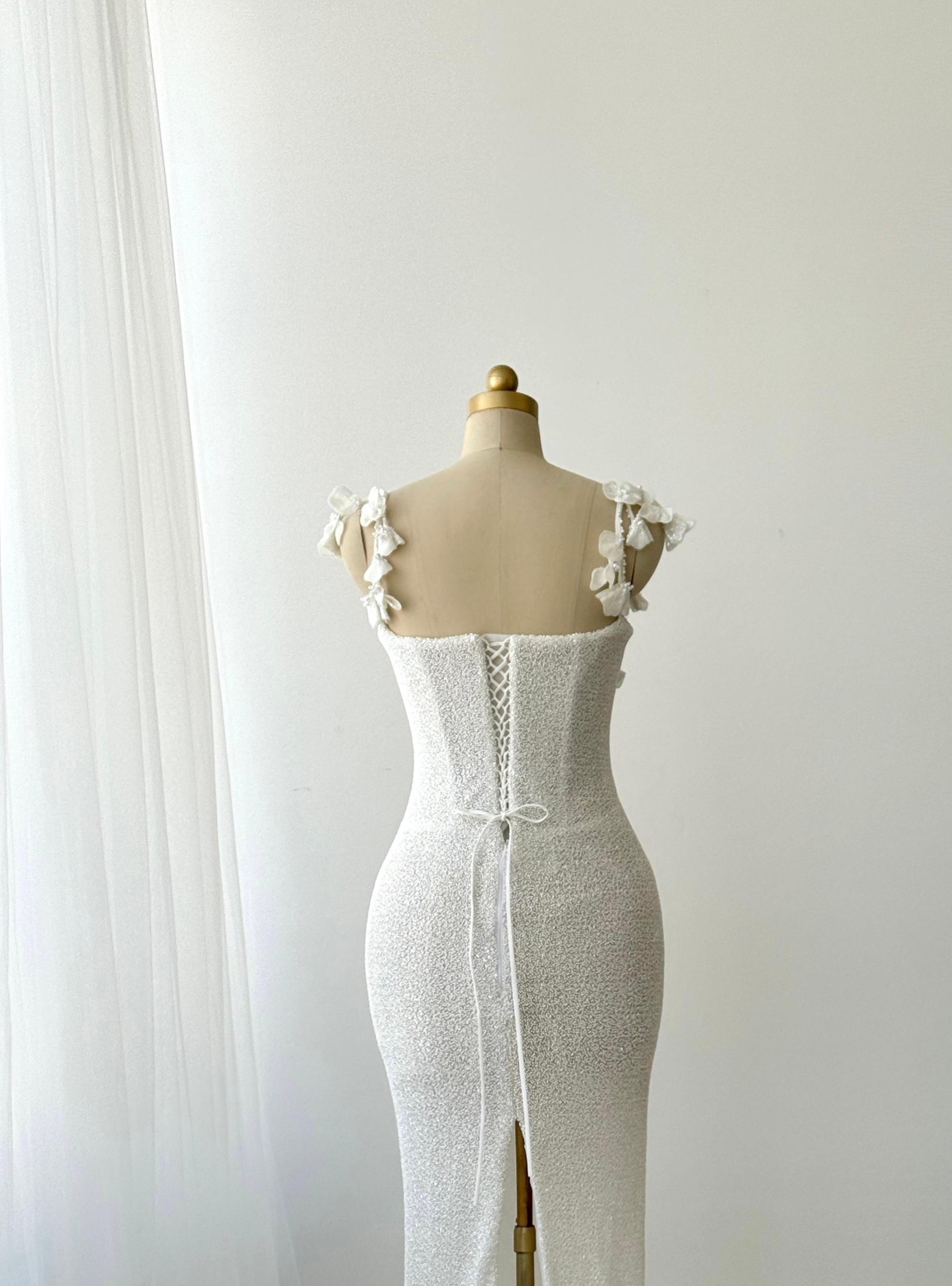 White Mermaid bridal gown with spaghetti straps and embroidery