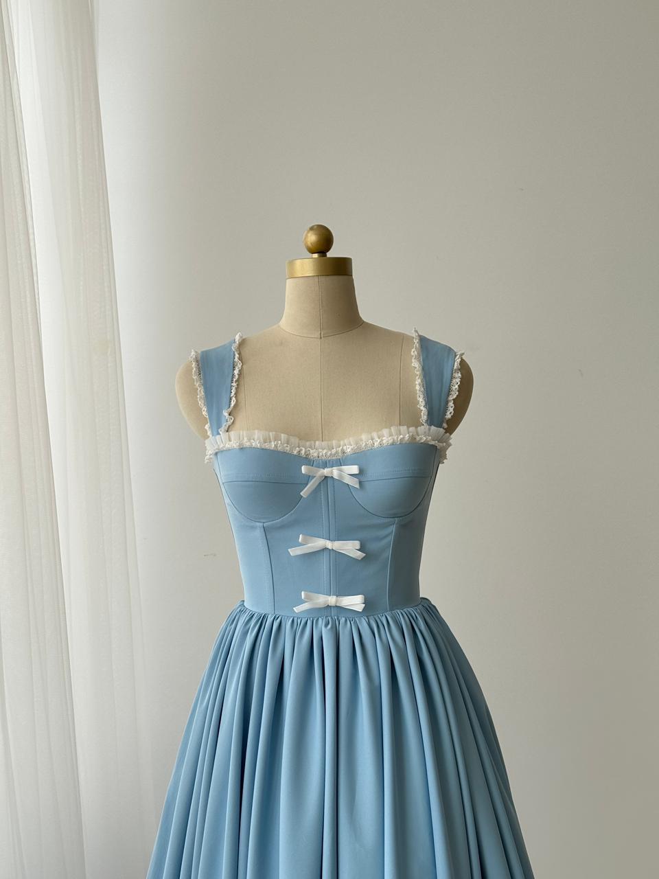 Light blue midi dress with straps, embroidered bows and lace