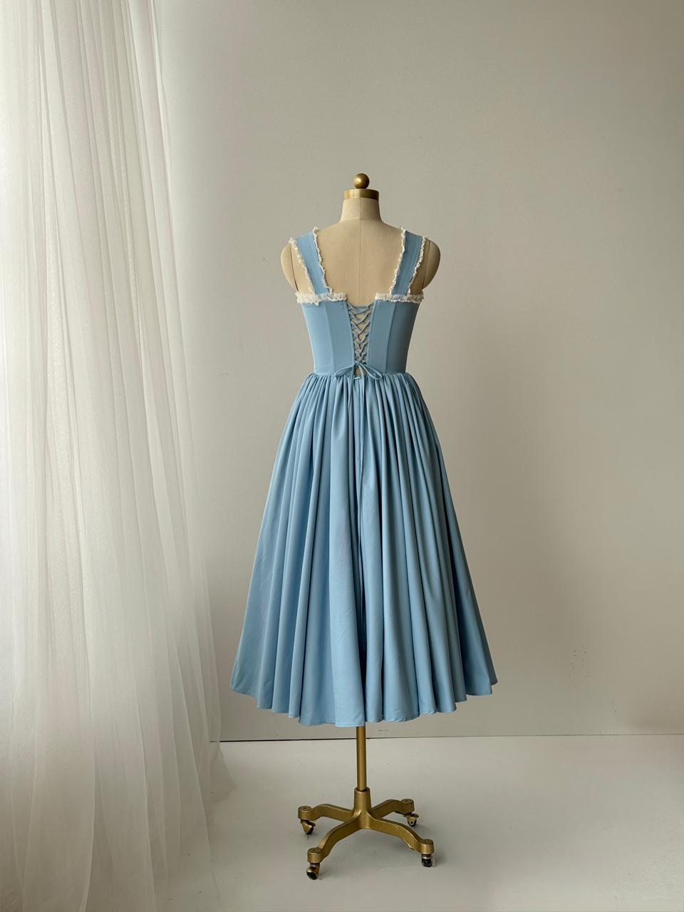 Light blue midi dress with straps, embroidered bows and lace