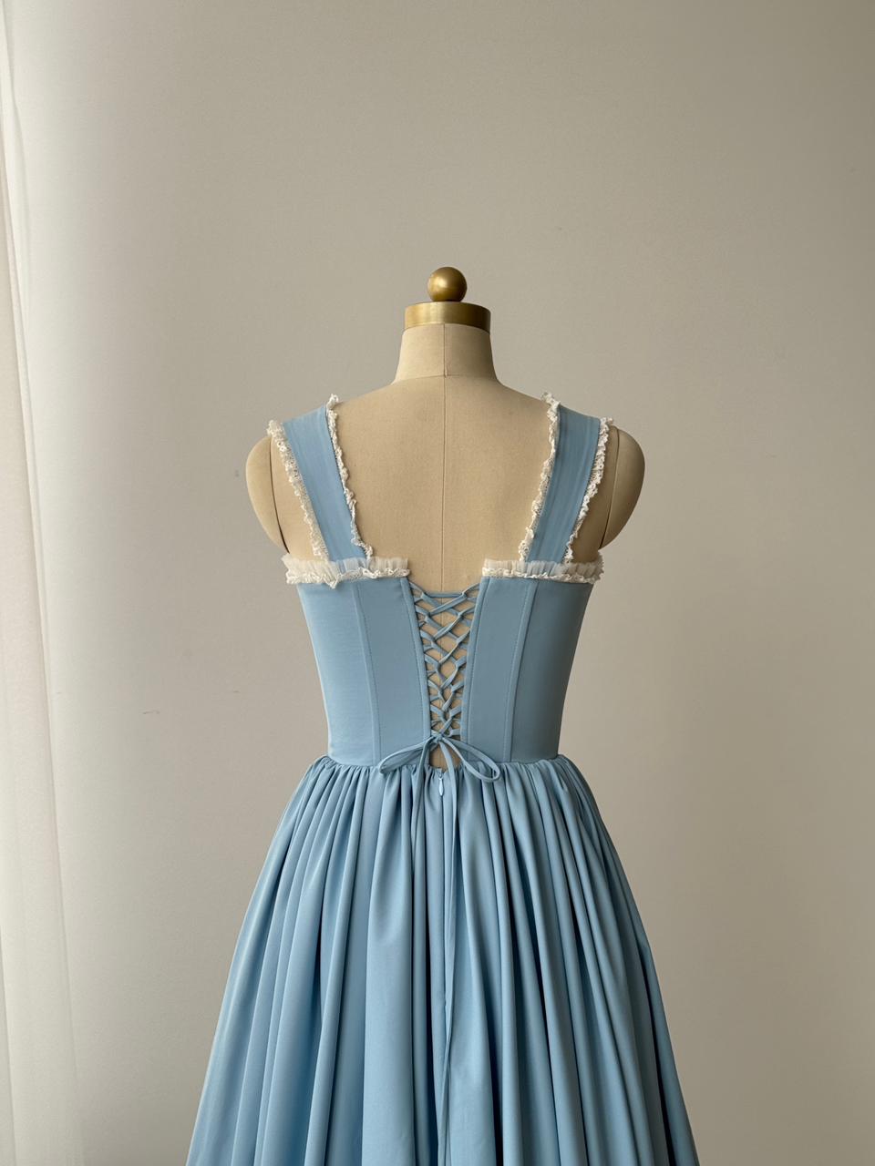 Light blue midi dress with straps, embroidered bows and lace