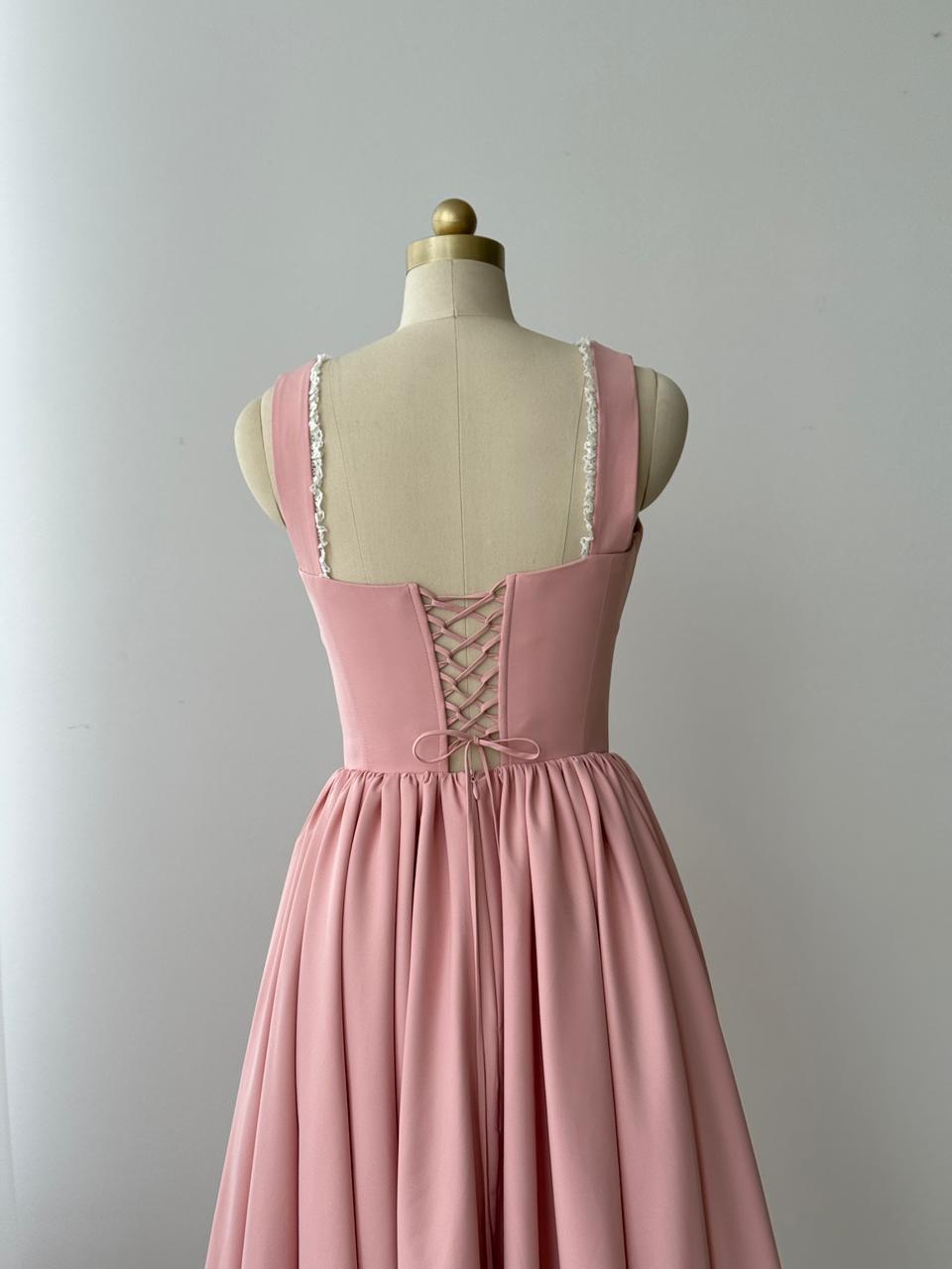Pink midi dress with embroidered bows, lace and no sleeves