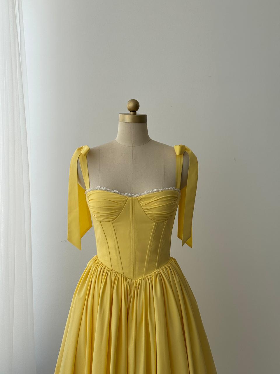 Yellow midi dress with bow straps and lace