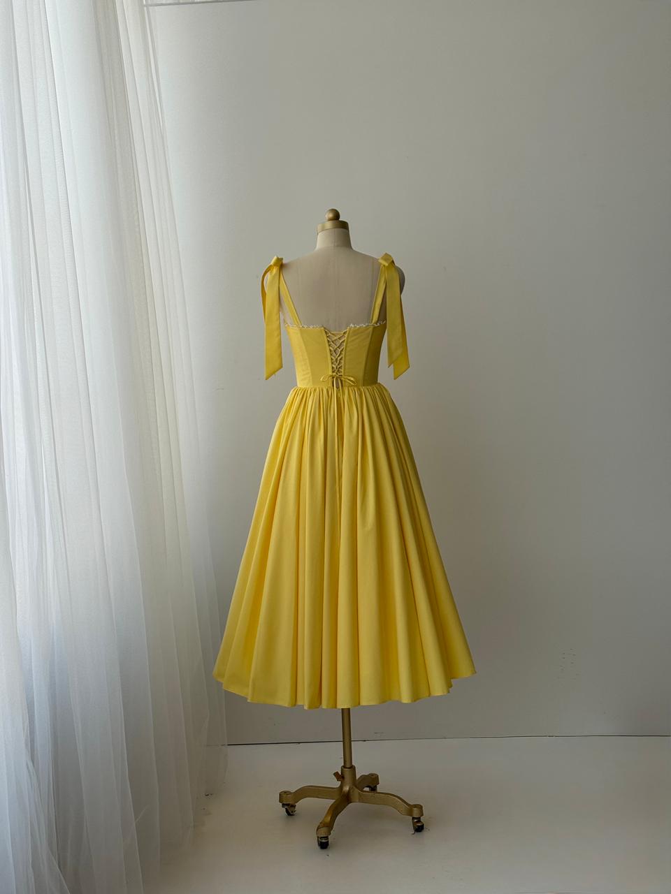 Yellow midi dress with bow straps and lace