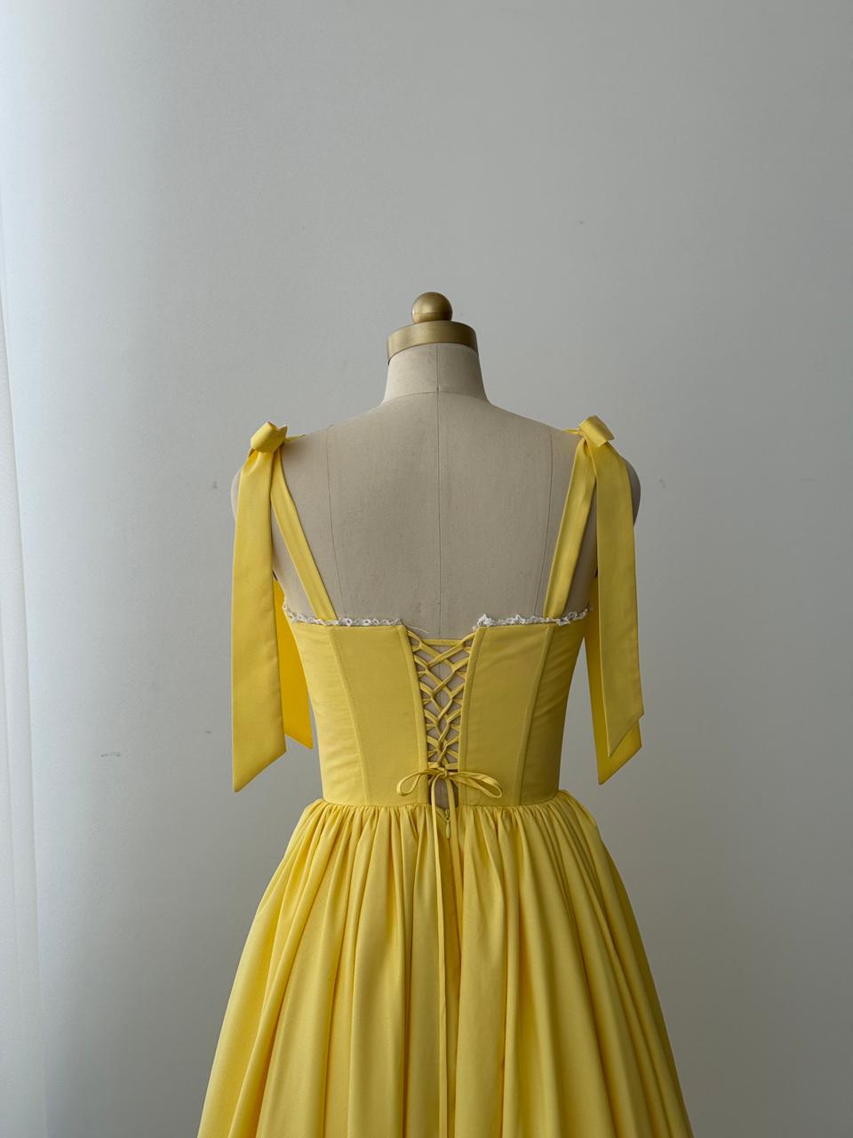 Yellow midi dress with bow straps and lace