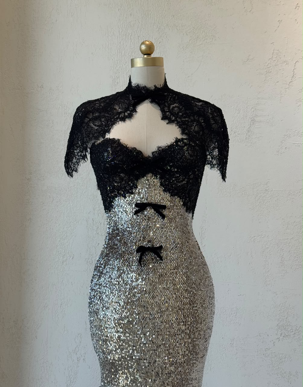 Black and grey mermaid gown with lace, sequins, embroidered bows and bolero