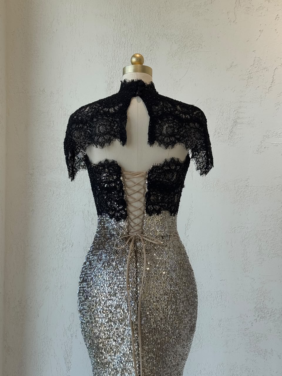 Black and grey mermaid gown with lace, sequins, embroidered bows and bolero