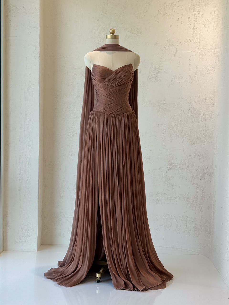 Brown A-Line gown, with draped fabric, cape and no sleeves