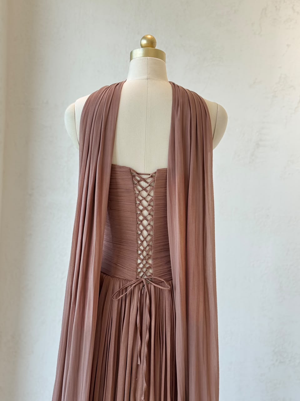 Brown A-Line gown, with draped fabric, cape and no sleeves