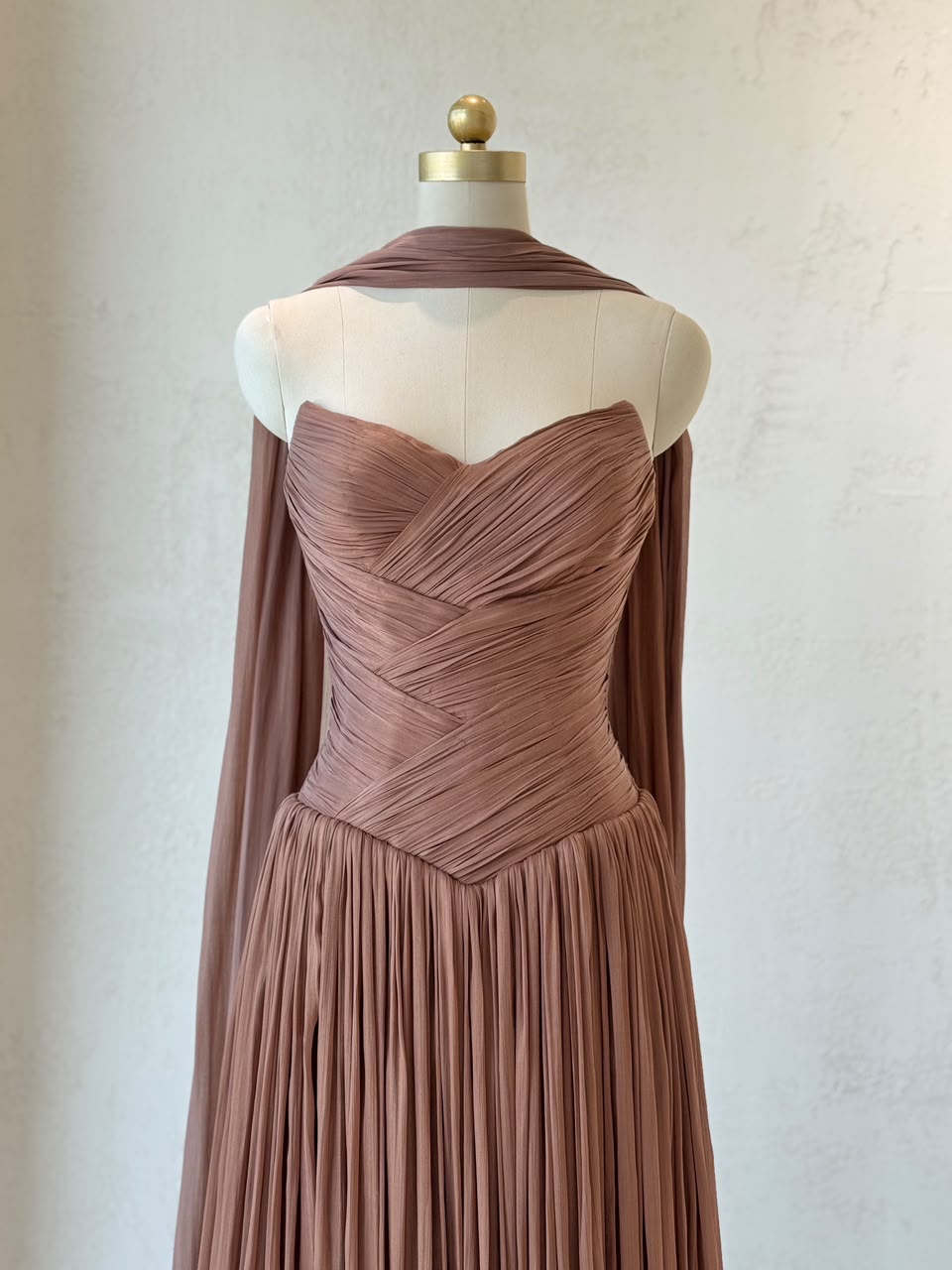 Brown A-Line gown, with draped fabric, cape and no sleeves