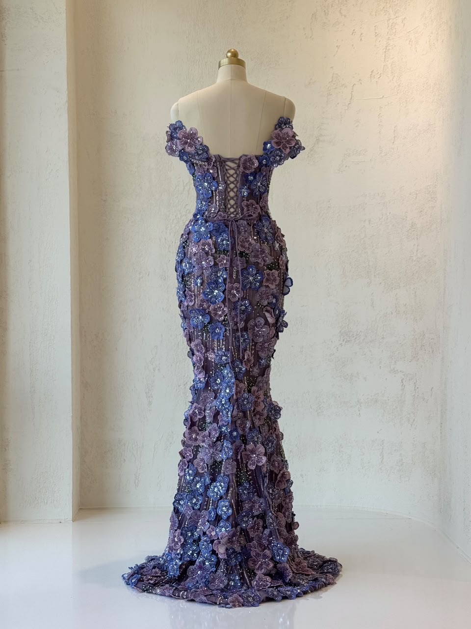 Purple mermaid gown with of the shoulder sleeves and embroidered flowers
