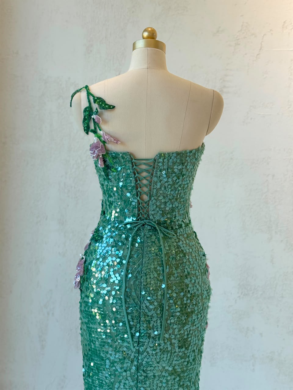 Green mermaid gown with one shoulder strap, sequins and embroidery