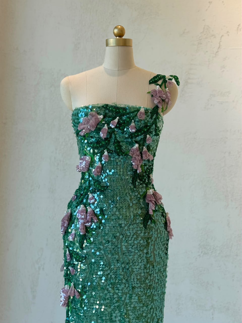 Green mermaid gown with one shoulder strap, sequins and embroidery