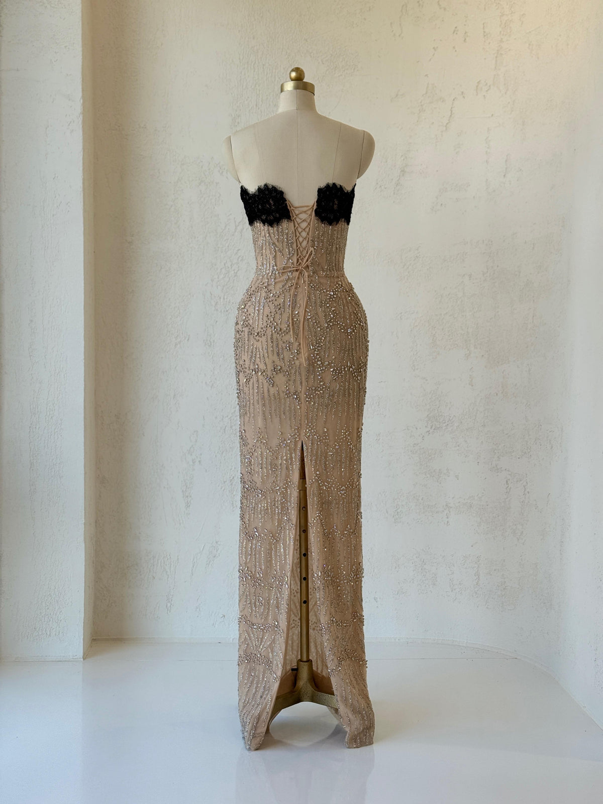 Beige mermaid gown with embroidered lace, beading and no sleeves