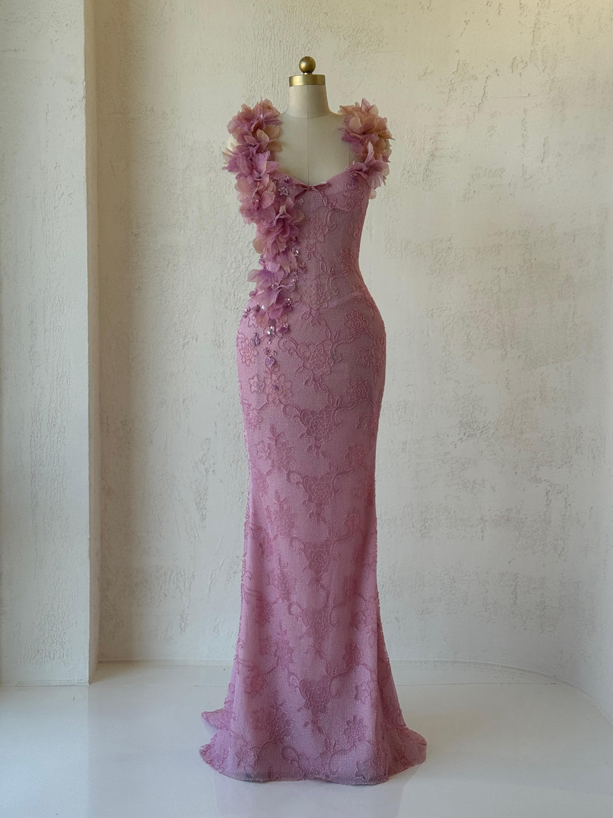Pink mermaid gown with straps, floral embroidery and bow